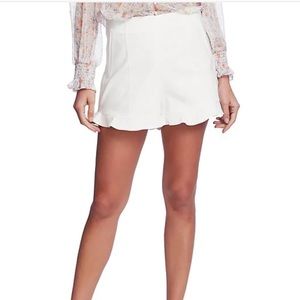Flat Front Ruffle Hem Mid Rise Shorts
